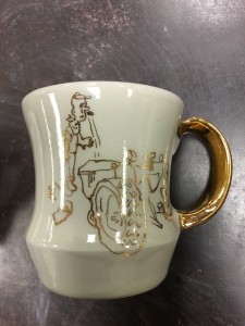 gold luster / decal application in ceramics workshop by melanie sherman - student work sample