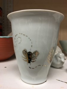 gold luster / decal application in ceramics workshop